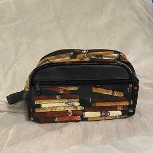 Nicole Miller Makeup Bag-canvas w/cigar design. Like new condition